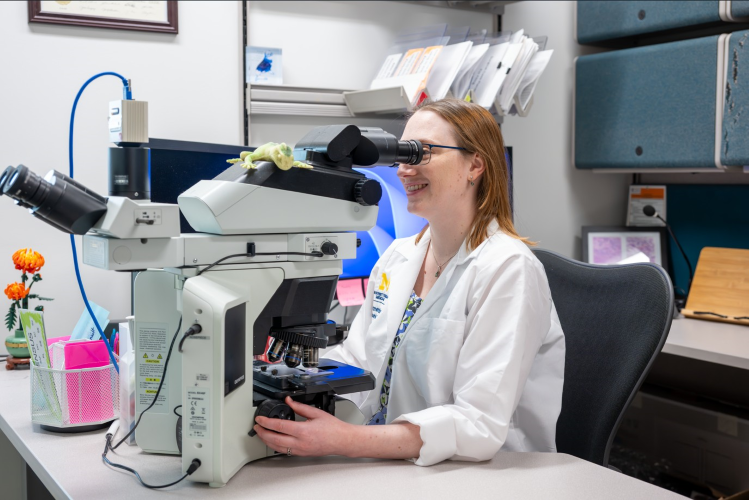 Dr. Kelsey Hummel reviews patient slides.